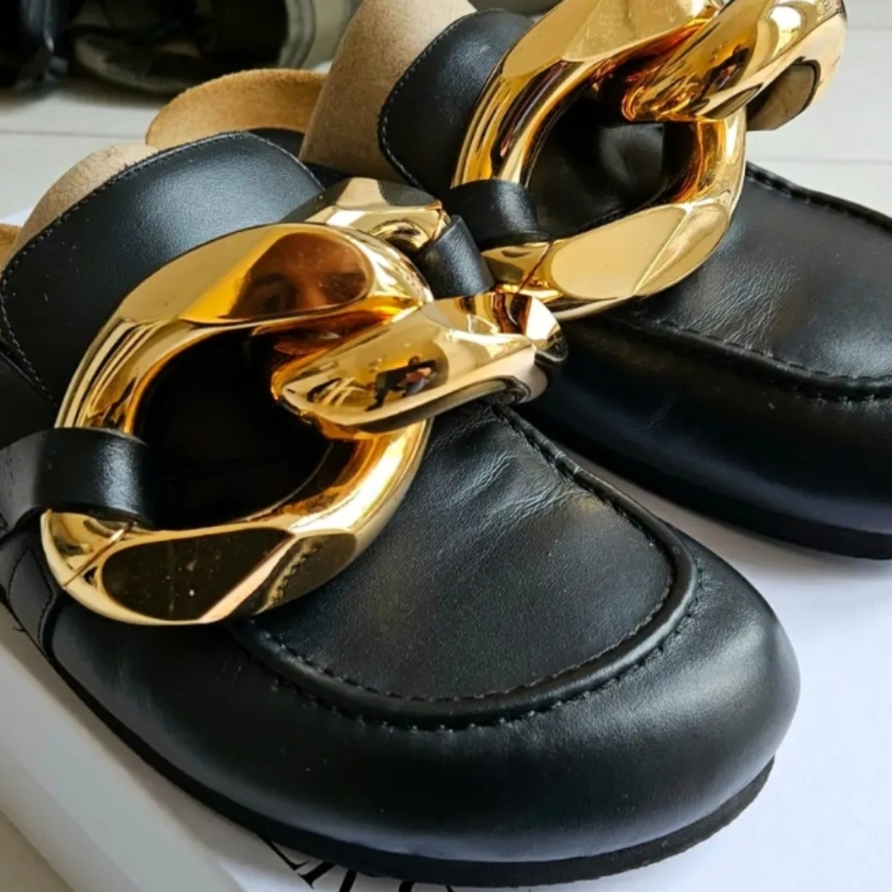 JW Anderson slides..black and gold